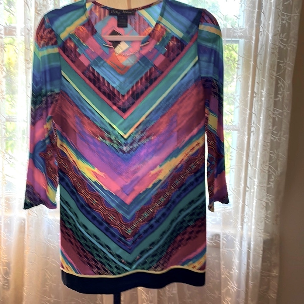 Dress, fun bright multi colored with long sleeves.